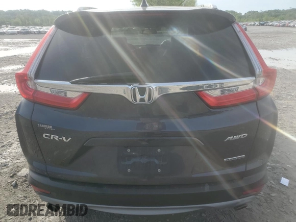 2018 Honda CR-V Touring z VIN 7FARW2H94JE077885, wystawiony jako Copart lot #55451345 z przebiegiem 133 964 mil mil oraz Szkoda całkowita • Salvage title. Historia ofert i sprzedaży dostępna na DreamBid. Obrazek 6.