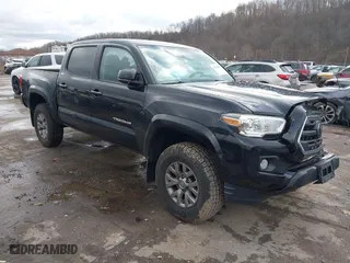 2019 Toyota Tacoma 4WD SR with VIN 3TMCZ5AN6KM203517, listed as a IAAI auction lot 40962602 with 188,726 mi miles. Bid and sale history available at carsss.com. Image 1.