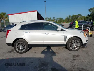 2015 Cadillac SRX Premium Collection with VIN 3GYFNDE32FS530357, listed as a IAAI auction lot 41976585 with 92,335 mi miles and . Bid and sale history available at carsss.com. Image 13.