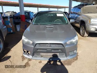 2014 Mitsubishi Lancer Evolution GSR with VIN JA32W8FV3EU008262, listed as a IAAI auction lot 41653902 with 128,977 mi miles. Bid and sale history available at carsss.com. Image 12.