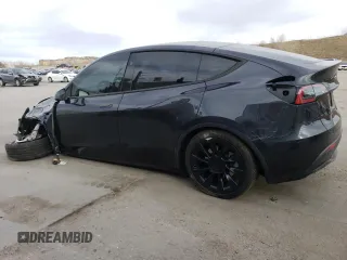2024 Tesla Model Y Long Range with VIN 7SAYGAEE5RF038446, listed as a Copart auction lot 48868025 with 10,410 mi miles and Salvage Title. Bid and sale history available at DreamBid. Image 2.