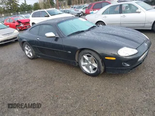 1997 Jaguar XK with VIN SAJGX5741VC004596, listed as a IAAI auction lot 41588751 with 188,607 mi miles and . Bid and sale history available at DreamBid. Image 1.