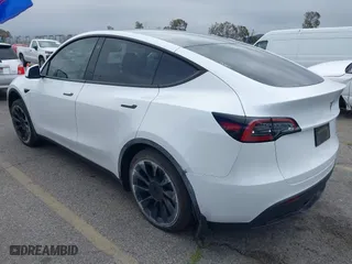 2023 Tesla Model Y Long Range with VIN 7SAYGDEE7PA023295, listed as a IAAI auction lot 41773783 with 28,079 mi miles. Bid and sale history available at carsss.com. Image 3.