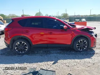 2016 Mazda CX-5 Grand Touring with VIN JM3KE2DYXG0652017, listed as a IAAI auction lot 42041158 with 95,946 mi miles and . Bid and sale history available at DreamBid. Image 13.