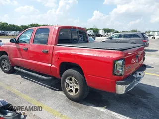 2006 Dodge Dakota SLT with VIN 1D7HE48K06S517772, listed as a IAAI auction lot 41946417 with 255,236 mi miles and . Bid and sale history available at carsss.com. Image 3.