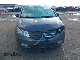 2011 Honda Odyssey Touring with VIN 5FNRL5H93BB104436, listed as a IAAI auction lot 40426003 with 93,342 mi miles and . Bid and sale history available at DreamBid. Image 6.