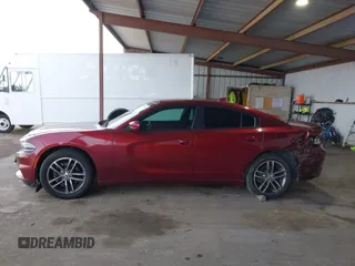 2019 Dodge Charger SXT with VIN 2C3CDXJG0KH757909, listed as a IAAI auction lot 41597907 with 71,882 mi miles and . Bid and sale history available at DreamBid. Image 14.