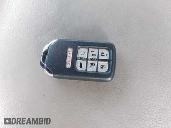2021 Honda Odyssey Touring with VIN 5FNRL6H80MB010952, listed as a IAAI auction lot 42080412 with 90,594 mi miles and . Bid and sale history available at DreamBid. Image 11.