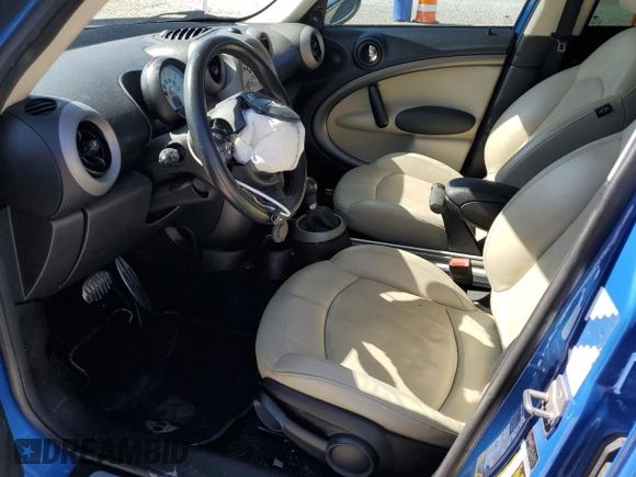 2011 MINI Countryman S with VIN WMWZC5C54BWL53955, listed as a Copart auction lot 52187405 with 124,470 mi miles and Salvage Title. Bid and sale history available at DreamBid. Image 7.