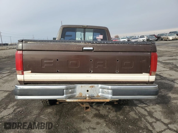 1991 Ford F-250 z VIN 1FTHX26G1MKB21130, wystawiony jako Copart lot #42222245 z przebiegiem 13 849 mil mil oraz Szkoda całkowita • Salvage title. Historia ofert i sprzedaży dostępna na DreamBid. Obrazek 6.