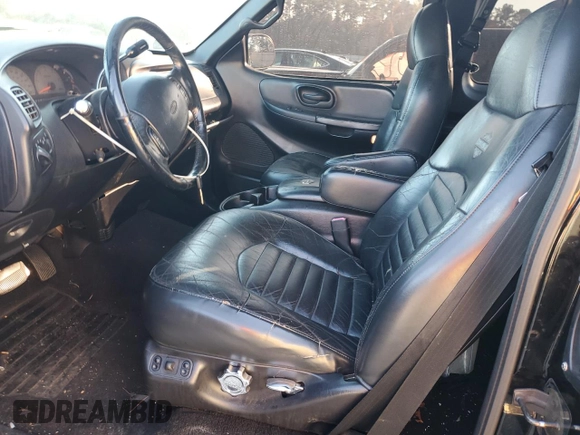 1999 Ford F-150 XL with VIN 2FTRX07W0XCA08082, listed as a Copart auction lot 82246214 with 189,950 mi miles and Salvage title. Bid and sale history available at DreamBid. Image 7.