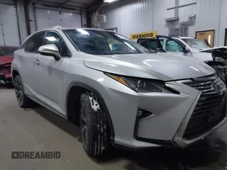2017 Lexus RX with VIN 2T2BZMCAXHC067275, listed as a IAAI auction lot 41386504 with 100,477 mi miles. Bid and sale history available at carsss.com. Image 1.