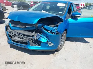 2014 Ford Focus SE with VIN 1FADP3K20EL383687, listed as a IAAI auction lot 42004089 with 127,374 mi miles. Bid and sale history available at carsss.com. Image 6.