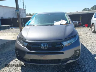 2025 Honda Odyssey Touring z VIN 5FNRL6H84SB028769, wystawiony jako IAAI lot #41856080 z przebiegiem Nie podano mil oraz . Historia ofert i sprzedaży dostępna na DreamBid. Obrazek 11.