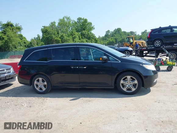 2011 Honda Odyssey Touring with VIN 5FNRL5H97BB073708, listed as a IAAI auction lot 42409164 with 141,986 mi miles and . Bid and sale history available at DreamBid. Image 13.
