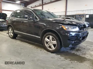 2011 Volkswagen Touareg Exec with VIN WVGFK9BP8BD003948, listed as a Copart auction lot 48285065 with 152,497 mi miles and Salvage Title. Bid and sale history available at DreamBid. Image 4.