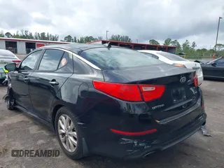 2015 Kia Optima EX z VIN 5XXGN4A72FG354497, wystawiony jako IAAI lot #42110643 z przebiegiem 117 751 mil mil oraz . Historia ofert i sprzedaży dostępna na DreamBid. Obrazek 3.
