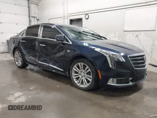 2019 Cadillac XTS Luxury z VIN 2G61M5S35K9157970, wystawiony jako IAAI lot #42455176 z przebiegiem 82 795 mil mil oraz . Historia ofert i sprzedaży dostępna na DreamBid. Obrazek 1.