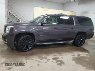 2015 GMC Yukon XL SLT with VIN 1GKS2HKCXFR153258, listed as a Copart auction lot 52449065 with 32,950 mi miles and Clean title. Bid and sale history available at DreamBid. Image 1.
