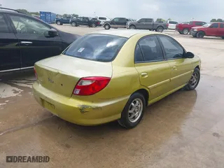 2001 Kia Rio with VIN KNADC123616048085, listed as a IAAI auction lot 42025600 with 123,493 mi miles. Bid and sale history available at carsss.com. Image 4.