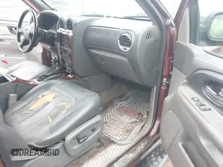 2003 GMC Envoy SLT z VIN 1GKDS13S532314397, wystawiony jako IAAI lot #41184274 z przebiegiem 232 750 mil mil oraz . Historia ofert i sprzedaży dostępna na DreamBid. Obrazek 5.