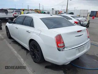 2012 Chrysler 300 Limited with VIN 2C3CCACG2CH237841, listed as a IAAI auction lot 42134640 with 140,554 mi miles. Bid and sale history available at carsss.com. Image 3.