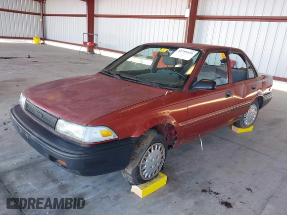 1990 Toyota Corolla z VIN 1NXAE94A1LZ117401, wystawiony jako IAAI lot #41755431 z przebiegiem 81 786 mil mil oraz . Historia ofert i sprzedaży dostępna na DreamBid. Obrazek 2.