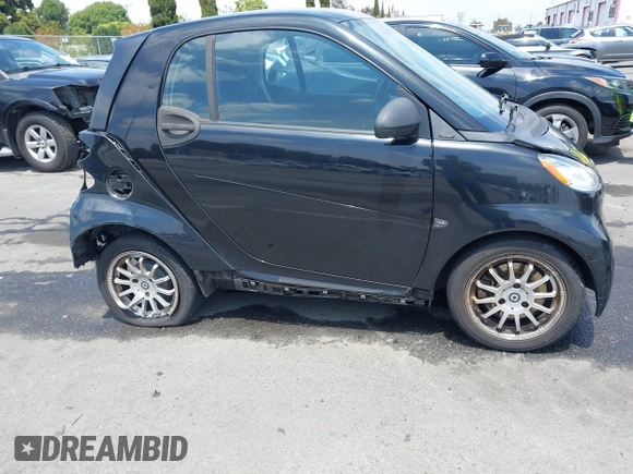 2012 Smart fortwo Pure z VIN WMEEJ3BA1CK556029, wystawiony jako IAAI lot #42173735 z przebiegiem 85 133 mil mil oraz . Historia ofert i sprzedaży dostępna na DreamBid. Obrazek 13.