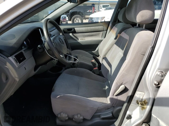2006 Suzuki Forenza z VIN KL5JD56Z66K299816, wystawiony jako Copart lot #81893914 z przebiegiem 156 416 mil mil oraz Szkoda całkowita • Salvage title. Historia ofert i sprzedaży dostępna na DreamBid. Obrazek 7.