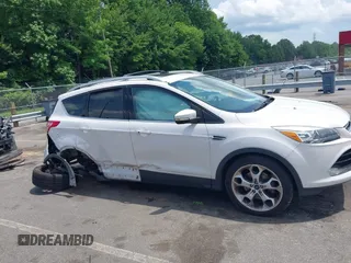 2016 Ford Escape Titanium with VIN 1FMCU9J90GUC48346, listed as a IAAI auction lot 42523307 with 114,265 mi miles and . Bid and sale history available at DreamBid. Image 13.