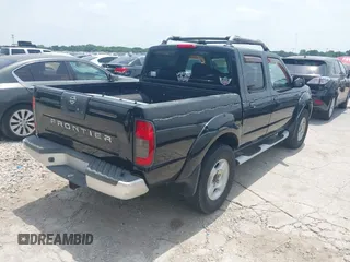 2001 Nissan Frontier SE with VIN 1N6ED27T81C305653, listed as a IAAI auction lot 42260643 with 245,547 mi miles and . Bid and sale history available at DreamBid. Image 4.
