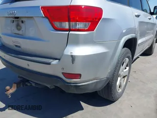 2012 Jeep Grand Cherokee Laredo with VIN 1C4RJEAG5CC112230, listed as a IAAI auction lot 41997483 with 302,923 mi miles. Bid and sale history available at carsss.com. Image 17.
