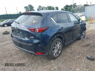 2019 Mazda CX-5 Grand Touring with VIN JM3KFBDM8K1521231, listed as a IAAI auction lot 42738963 with 32,179 mi miles and . Bid and sale history available at DreamBid. Image 4.