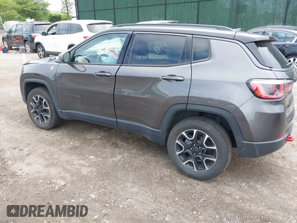 2020 Jeep Compass Trailhawk with VIN 3C4NJDDB3LT200268, listed as a IAAI auction lot 42250192 with 73,804 mi miles and . Bid and sale history available at DreamBid. Image 3.