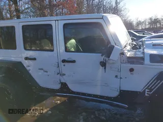 2014 Jeep Wrangler Unlimited Sahara with VIN 1C4HJWEG2EL273813, listed as a IAAI auction lot 41311011 with 96,104 mi miles. Bid and sale history available at carsss.com. Image 13.