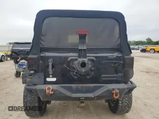 2007 Jeep Wrangler Unlimited Rubicon with VIN 1J4GA69117L112867, listed as a Copart auction lot 59909565 with 166,963 mi miles and Salvage title. Bid and sale history available at DreamBid. Image 6.