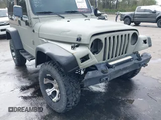 1999 Jeep Wrangler Sahara with VIN 1J4FY49S0XP480017, listed as a IAAI auction lot 41642577 with 154,068 mi miles. Bid and sale history available at carsss.com. Image 6.