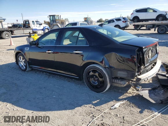 2009 Cadillac STS AWD z VIN 1G6DD67V690120833, wystawiony jako Copart lot #42502345 z przebiegiem 100 250 mil mil oraz Szkoda całkowita • Salvage title. Historia ofert i sprzedaży dostępna na DreamBid. Obrazek 2.