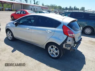 2016 Ford Fiesta SE z VIN 3FADP4EJ0GM122392, wystawiony jako IAAI lot #42364419 z przebiegiem 98 357 mil mil oraz . Historia ofert i sprzedaży dostępna na DreamBid. Obrazek 3.