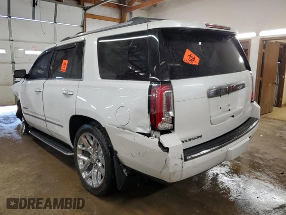 2017 GMC Yukon Denali with VIN 1GKS2CKJ0HR217831, listed as a Copart auction lot 48030555 with 163,050 mi miles and Salvage Title. Bid and sale history available at carsss.com. Image 2.