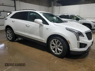 2021 Cadillac XT5 AWD Sport with VIN 1GYKNGRS5MZ142444, listed as a Copart auction lot 54502285 with 27,070 mi miles and Salvage title. Bid and sale history available at DreamBid. Image 4.