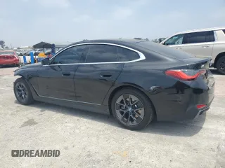 2024 BMW i4 eDrive35 with VIN WBY43AW02RFT03098, listed as a Copart auction lot 57317884 with 203 mi miles and Salvage Title. Bid and sale history available at carsss.com. Image 2.