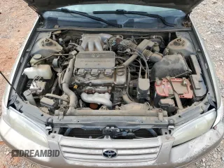 1999 Toyota Camry LE z VIN JT2BF28K9X0199531, wystawiony jako Copart lot #55637275 z przebiegiem Nie podano mil oraz Szkoda całkowita • Salvage title. Historia ofert i sprzedaży dostępna na DreamBid. Obrazek 11.