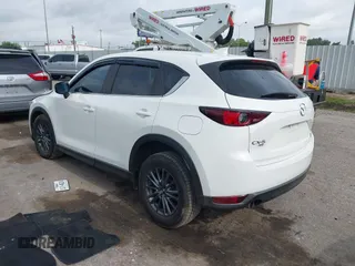 2020 Mazda CX-5 Touring z VIN JM3KFBCM2L0786784, wystawiony jako IAAI lot #42127457 z przebiegiem 62 665 mil mil oraz . Historia ofert i sprzedaży dostępna na DreamBid. Obrazek 3.