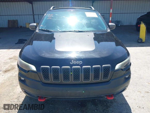 2019 Jeep Cherokee Trailhawk Elite with VIN 1C4PJMBX0KD198328, listed as a IAAI auction lot 42085194 with 76,312 mi miles and . Bid and sale history available at DreamBid. Image 13.
