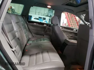 2004 Volkswagen Touareg z VIN WVGCM67L94D032492, wystawiony jako Copart lot #72205044 z przebiegiem 98 482 mil mil oraz Tytuł czysty. Historia ofert i sprzedaży dostępna na DreamBid. Obrazek 11.