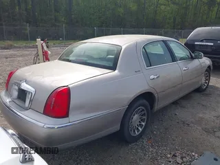2001 Lincoln Town Car Signature with VIN 1LNHM82W21Y684197, listed as a IAAI auction lot 41944429 with 159,297 mi miles and . Bid and sale history available at DreamBid. Image 4.