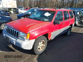 1997 Jeep Grand Cherokee Laredo with VIN 1J4GZ58S0VC550242, listed as a IAAI auction lot 41032114 with 185,307 mi miles. Bid and sale history available at carsss.com. Image 6.