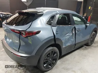 2022 Mazda CX-30 S Carbon Edition with VIN 3MVDMBCL8NM447234, listed as a IAAI auction lot 42511600 with 51,926 mi miles and . Bid and sale history available at DreamBid. Image 6.