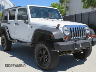 2012 Jeep Wrangler Unlimited Sport z VIN 1C4BJWDG4CL109807, wystawiony jako Copart lot #58862975 z przebiegiem 146 618 mil mil oraz Szkoda całkowita • Salvage title. Historia ofert i sprzedaży dostępna na DreamBid. Obrazek 1.